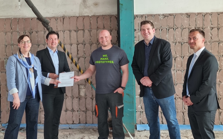 Übergabe des Förderbescheides im Rohbau